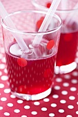 Raspberry juice in spotted glass