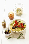 Pasta with cherry tomatoes, olives and anchovies