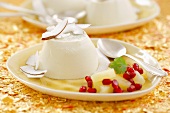 Panna cotta with coconut, pineapple and pomegranate seeds