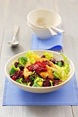 Salad leaves with deep-fried sheep's cheese and cranberry jam