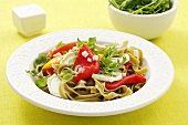 Green tagliatelle with grilled peppers, rocket and goat's cheese