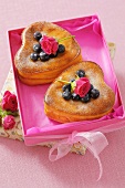 Heart-shaped cheesecakes with blueberries