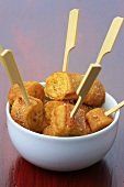 Banana fritters on wooden cocktail sticks