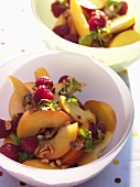 Peach and raspberry salad with nuts