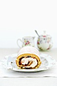 Sponge roll with cream and jam filling