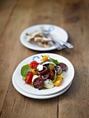 Caprese salad with different sorts of tomatoes