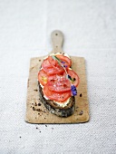 Tomato slices on bread with lavender butter