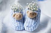 Blue and white baby shoes with gypsophila