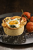 Fried egg with bacon in pizza dough shell