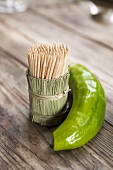 Green chilli and toothpicks