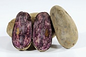 Potatoes (variety 'Blaue Elise'), whole and halved