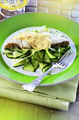 Fish fillet with saffron sauce and courgette ribbons