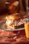 Puff pastry slice with orange cream filling