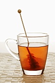 Cup of tea with sugar swizzle stick