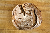Farmhouse bread on wooden background