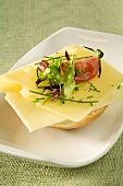 Cheese, tomato, chives and lettuce on bread roll