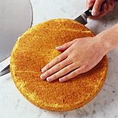 Splitting cake base with sharp knife