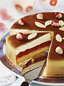 Cherry and marzipan cake, partly sliced