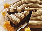 Cappuccino cake, partly sliced