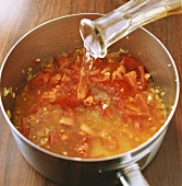 Making tomato sauce: adding white wine