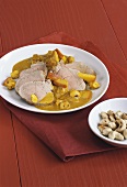Pork fillet with curried apple sauce and cashew nuts