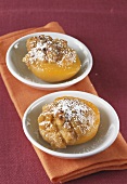 Baked peaches with icing sugar