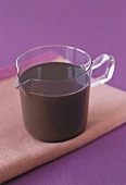 Chocolate sauce in glass jug
