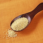 Millet in wooden spoon