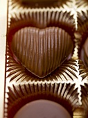 Heart-shaped chocolate in packaging (close-up)