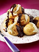 Profiteroles with white and dark chocolate filling