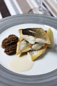 Fried sea bass with morels