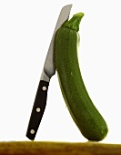 Courgette with knife