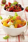 Melon and orange salad and marinated berries