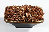 Whole grain red rice in dish