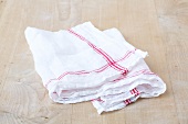 Straining cloth on wooden background