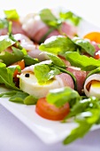 Mozzarella with Parma ham, tomatoes, basil and rocket