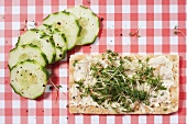 Crispbread with butter and cress, slices of cucumber