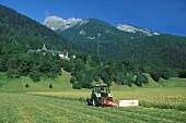 Farmer in a field with a tractor (France)