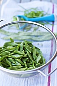 Sliced green beans in sieve