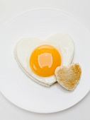 Heart-shaped fried egg and toast