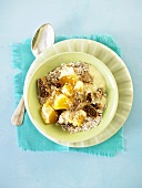 Muesli with sesame seeds, figs and oranges