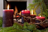 Advent arrangement in front of open fire