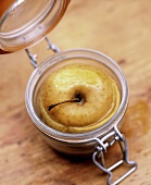 Stuffed apple with vanilla and tarragon baked in a jar