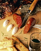 Diot (pork sausage) with pâté, polenta, wine and knife