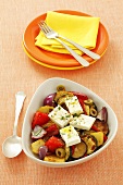 Fried vegetables with olives and feta