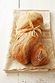 Rustic mixed grain bread with raffia bow