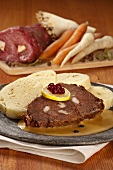 Beef studded with fat, with dumplings and cream sauce (Czech Republic)