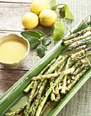 Grilled asparagus with orange and cashew nut dressing