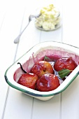 Plums baked in sugar with bay leaves