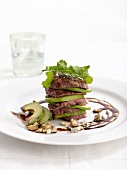 Slices of beef fillet with avocado, Gorgonzola and rocket
